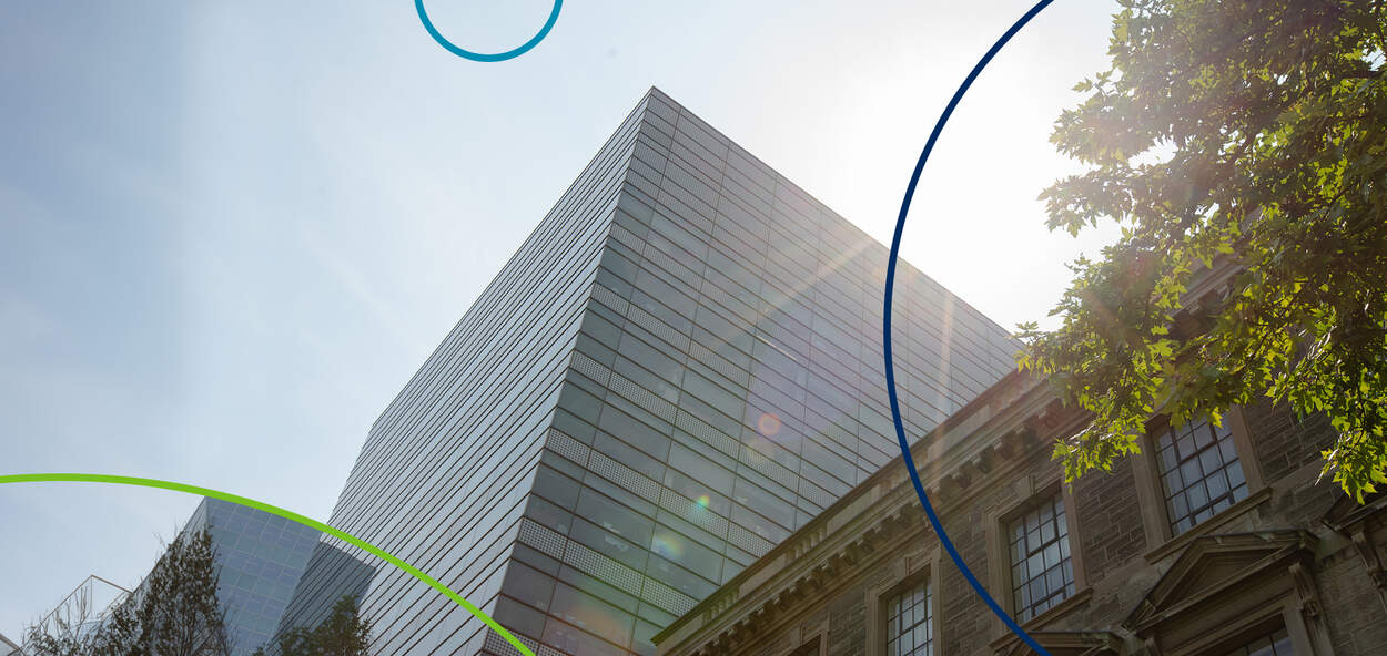 Image of Leslie Dan Faculty of Pharmacy building with blue sky and tree