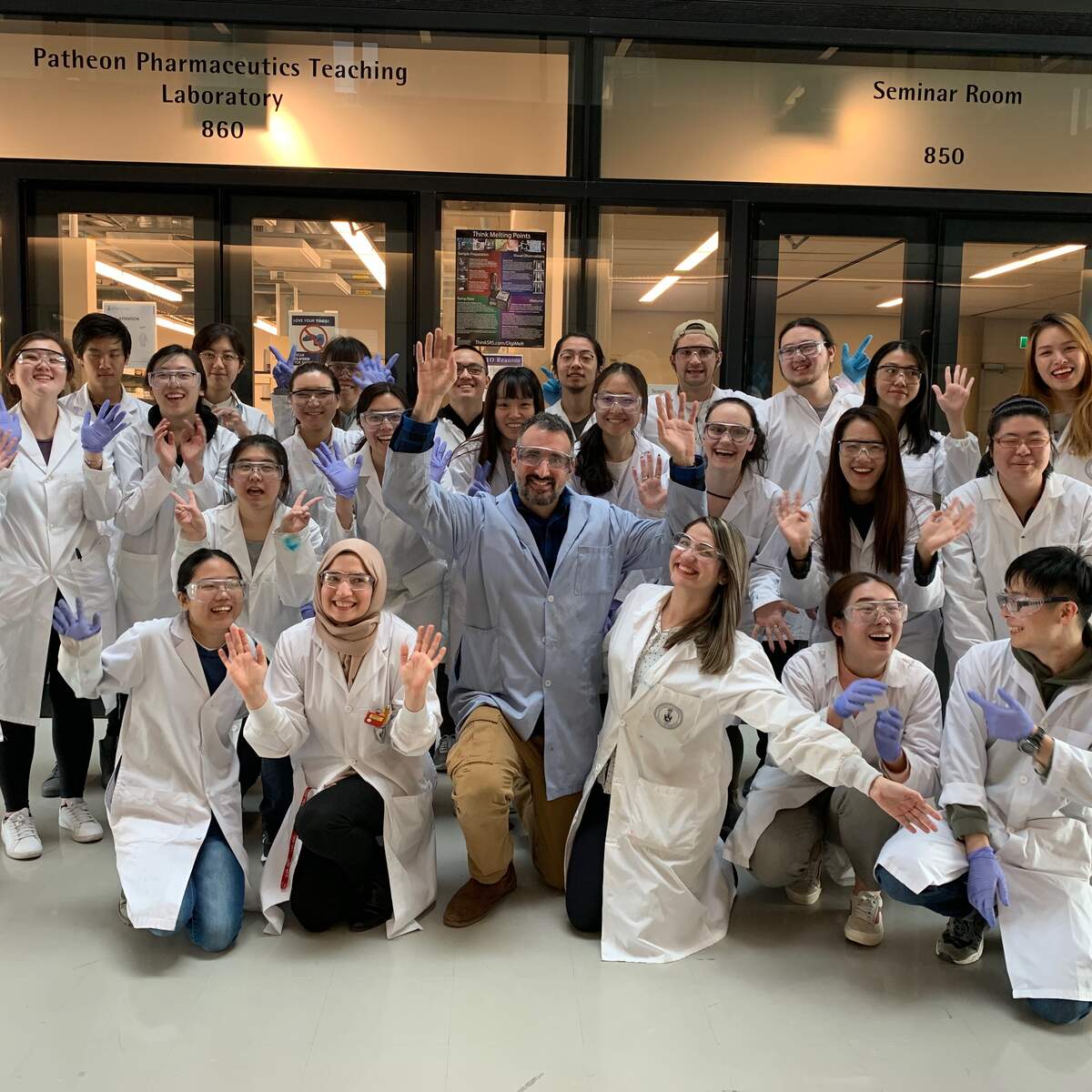 Professor David Dubins and students outside of lab