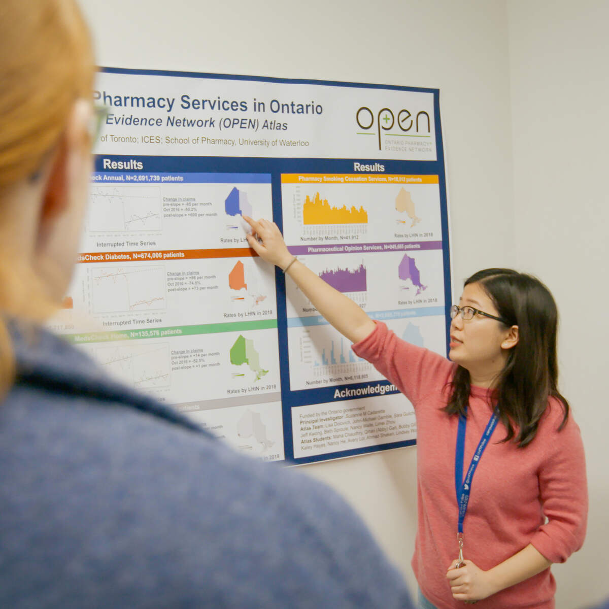 Graduate Student explaining poster research