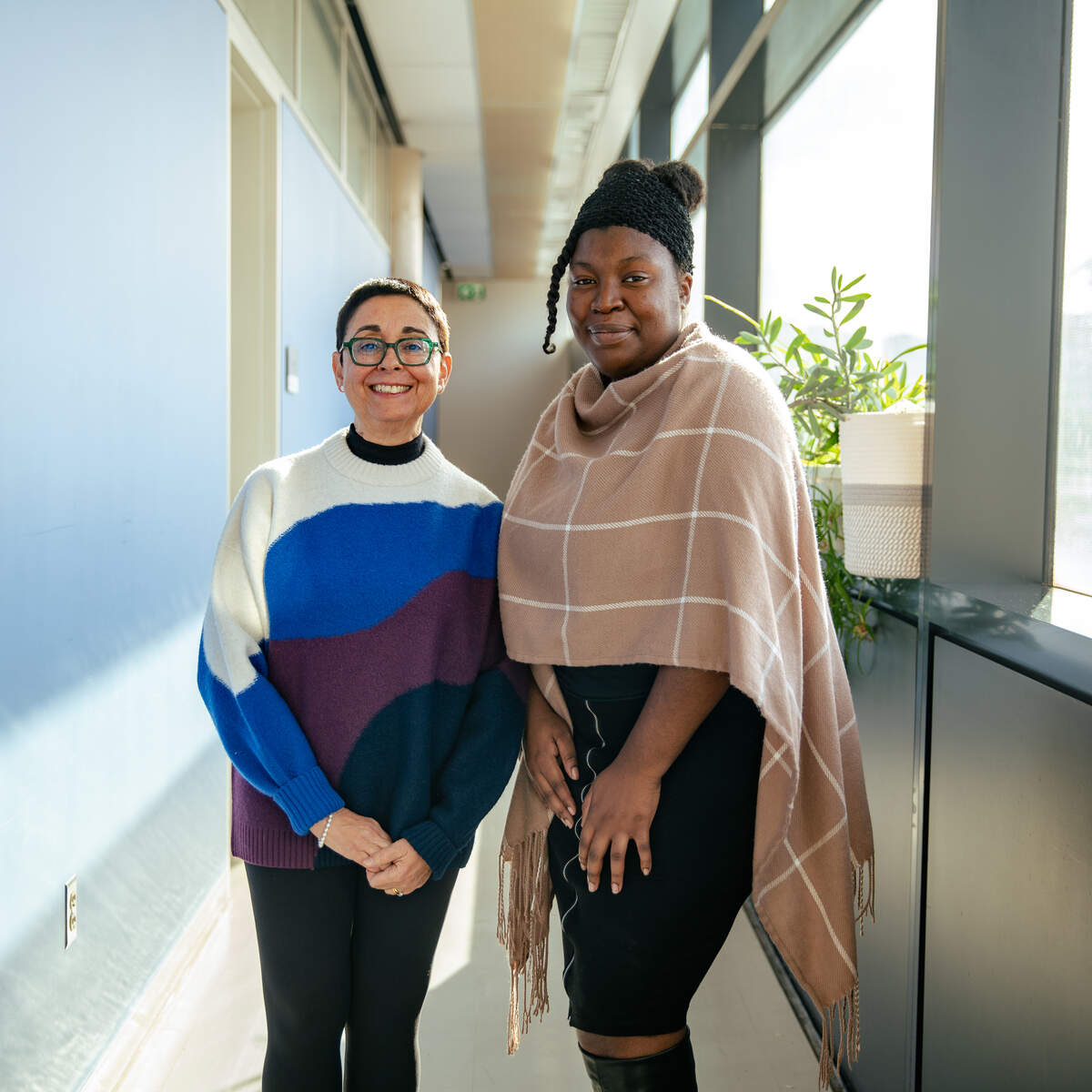 Professor Reina Bendayan and Pharmaceutical Sciences Masters student Teresa Bennett in hallway outside of Bendayan Lab